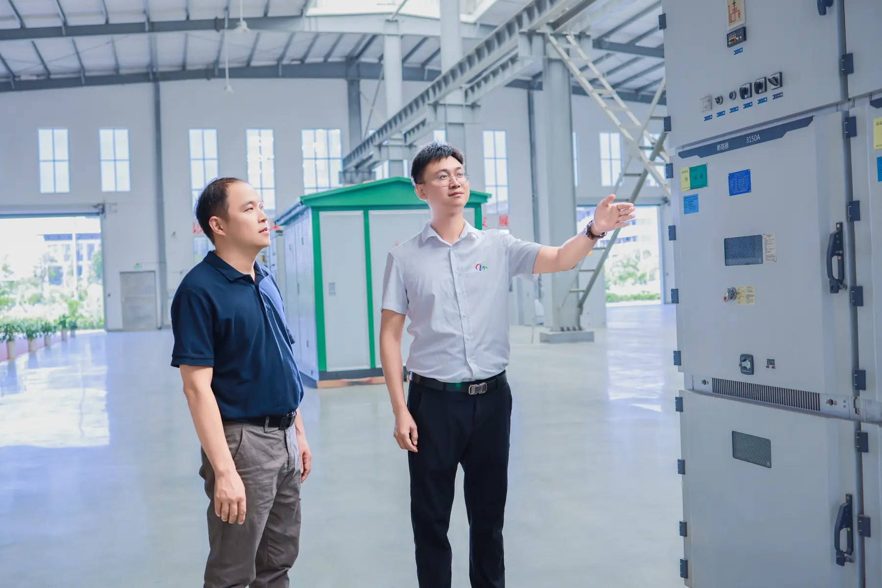 Minglang technical staff inspecting switchgear in the workshop